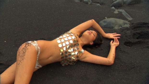 Cintia Dicker gets dirty during her SI Swimsuit shoot